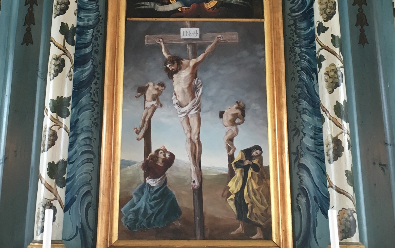 Utsnitt fra altertavlen i Lunde kirke i Nordre Land. Altertavlen er malt av Peder Aadnes, en av 1700-tallets meste kjente bygdemalere. Aadnes var fra Odnes i Søndre Land. Foto: Britt Agnethe Enemo.